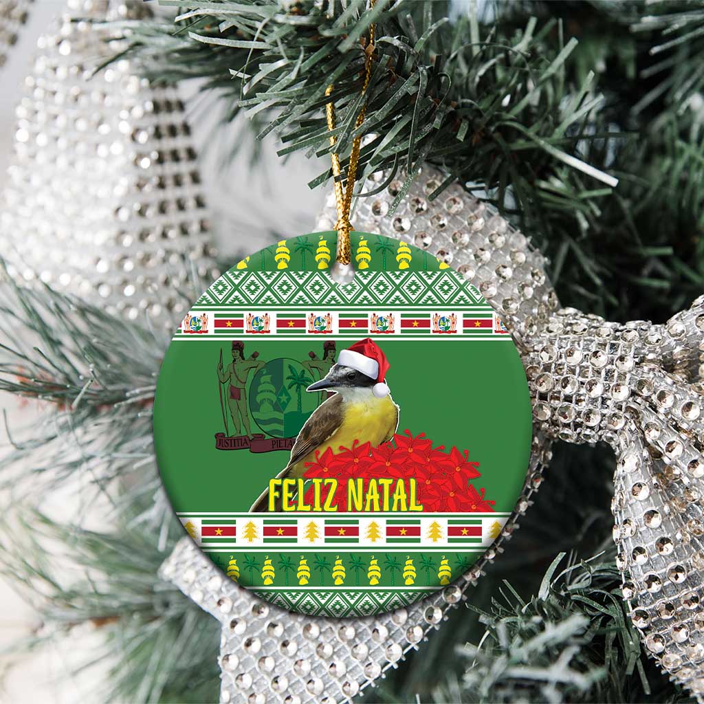 Green round ceramic ornament with kiskadee bird and Feliz Natal, hanging on tree