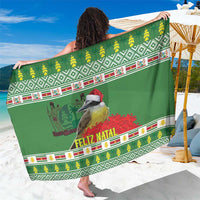 Green festive sarong with Feliz Natal text, birds and jungle geranium border