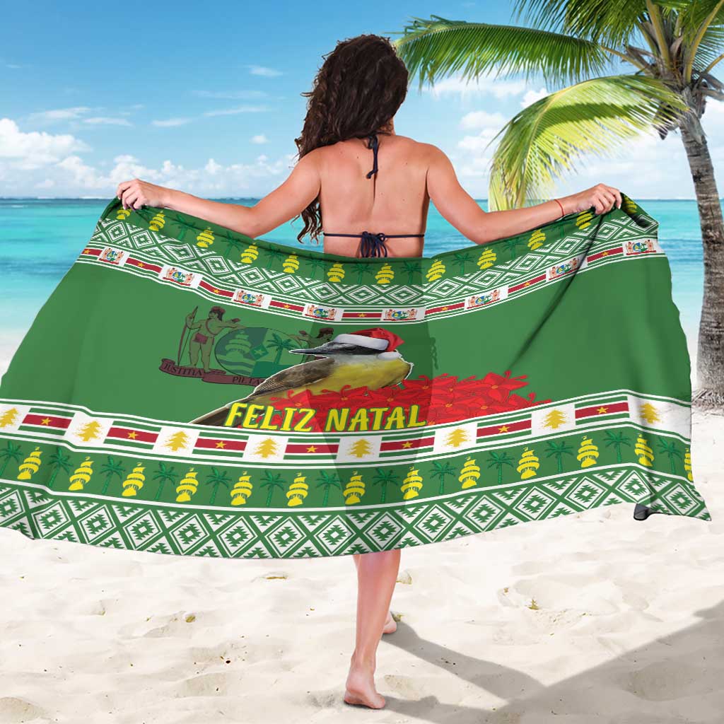 Green Feliz Natal sarong with geometric border and bird illustrations, draped