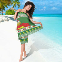 Green sarong with festive stripe border, bird and floral print