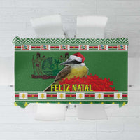 Green tablecloth with central bird, floral accents, and festive “FELIZ NATAL” border