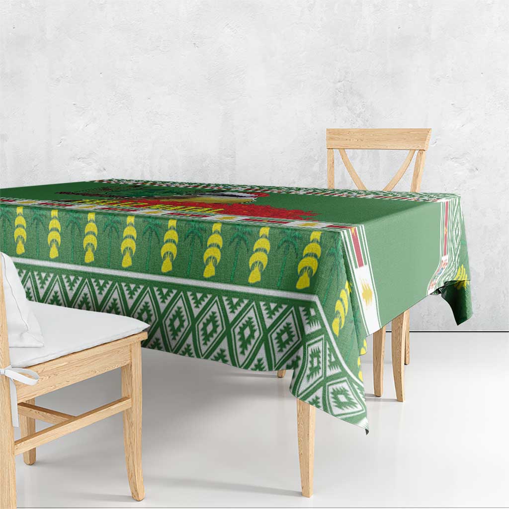 Green tablecloth with banana and geometric trim pattern, draped over a dining table