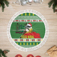 Green round tree skirt with white fringe edge, Feliz Natal lettering and bird on panels