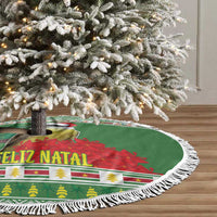 Green Christmas tree skirt with white tassel fringe and Feliz Natal holiday print