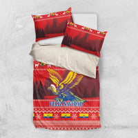 Red Christmas bedding set flat lay: comforter and two pillowcases with condor and FELIZ NAVIDAD