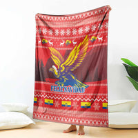 Red Feliz Navidad blanket draped flat with condor design and Christmas-style pattern