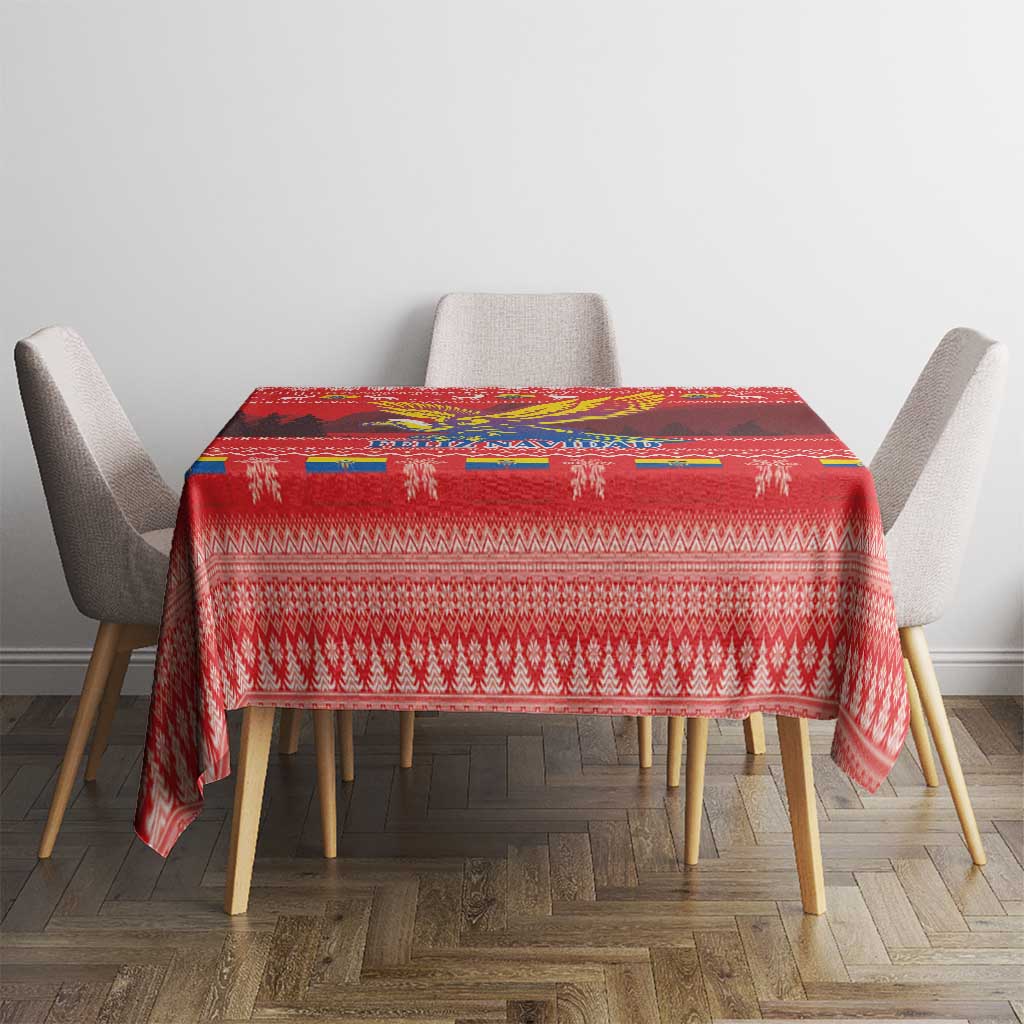 Red Christmas tablecloth with woven-style border patterns and condor artwork panel