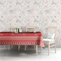 Red Christmas tablecloth with condor illustration, festive striping, and holiday pattern