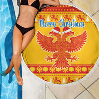 Yellow round Christmas beach blanket with white fringe, eagle design and Merry Christmas banner