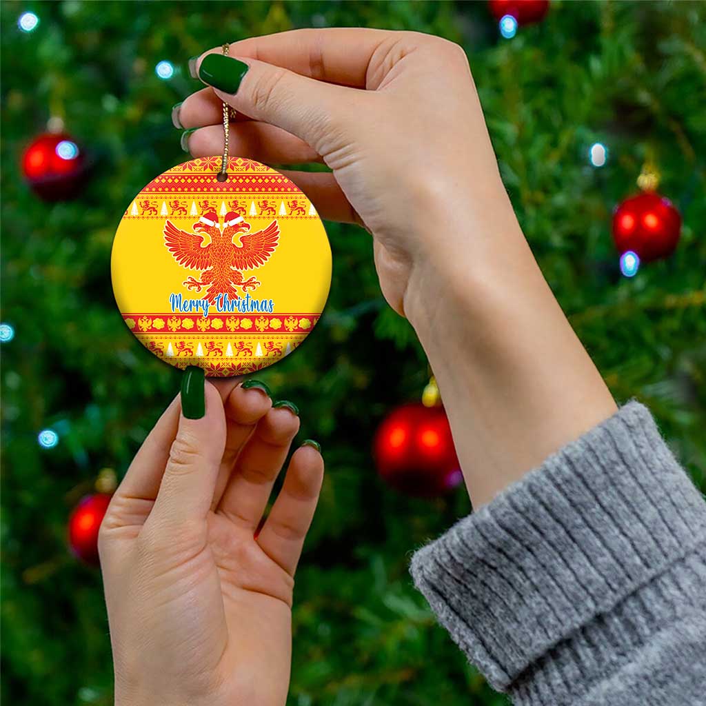 Yellow ceramic double-headed eagle Christmas ornament, round with red pattern and 'Merry Christmas'
