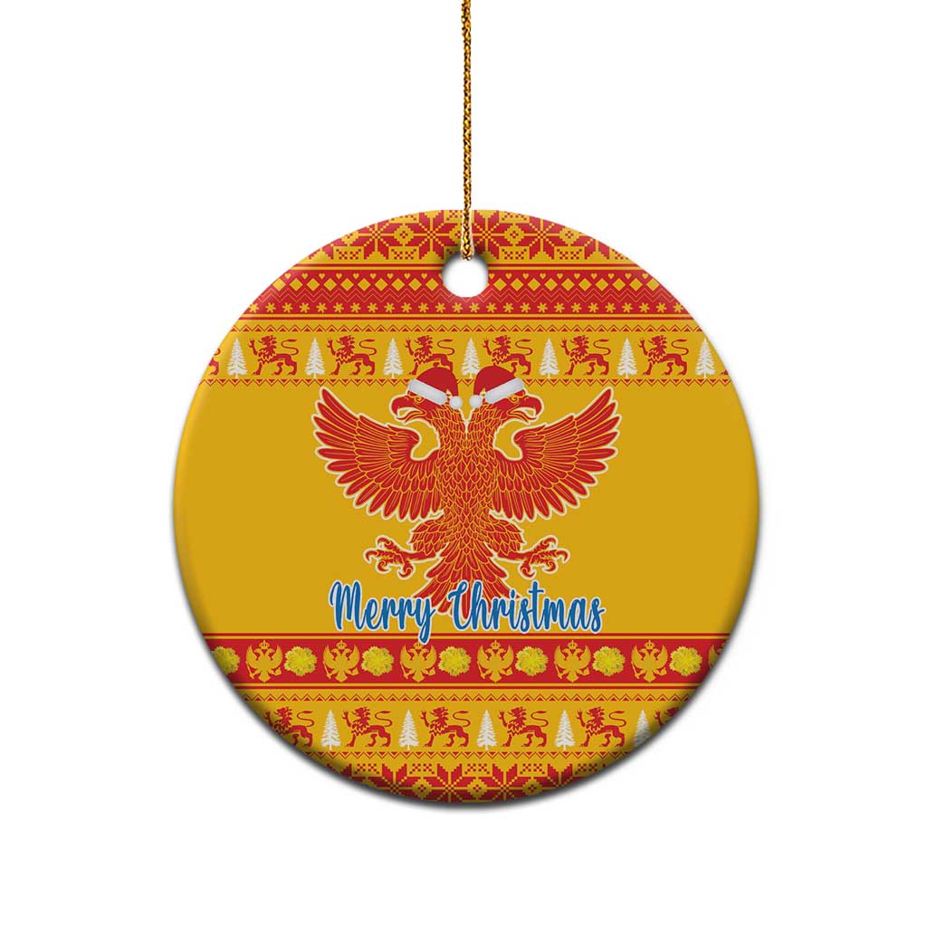 Yellow ceramic double-headed eagle Christmas ornament, round with red pattern and 'Merry Christmas'
