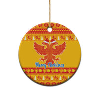 Yellow ceramic double-headed eagle Christmas ornament, round with red pattern and 'Merry Christmas'