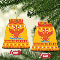 Yellow ceramic double-headed eagle Christmas ornaments, bell-shaped red pattern with 'Merry Christmas' and 'Montenegro'