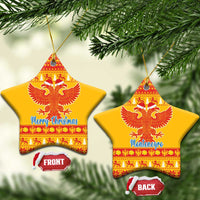 Yellow ceramic double-headed eagle Christmas ornaments, star-shaped red pattern with 'Merry Christmas' and 'Montenegro'