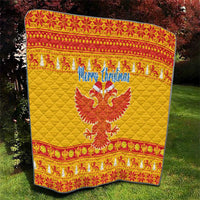 Yellow quilt with red patterned trim, “Merry Christmas” and double-headed eagle design