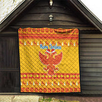 Yellow quilt with red trim, “Merry Christmas” and double-headed eagle, hanging display