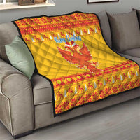 Yellow Christmas quilt with red border, double-headed eagle and “Merry Christmas” text