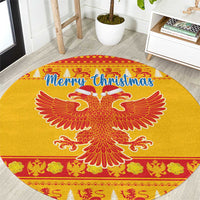 Yellow round Christmas area rug with double-headed eagle and “Merry Christmas” text