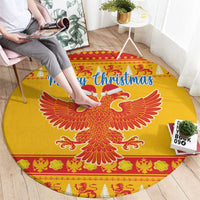 Yellow round Christmas rug with double-headed eagle center and “Merry Christmas” lettering