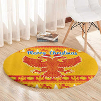 Yellow round Christmas area rug with double-headed eagle and “Merry Christmas” text