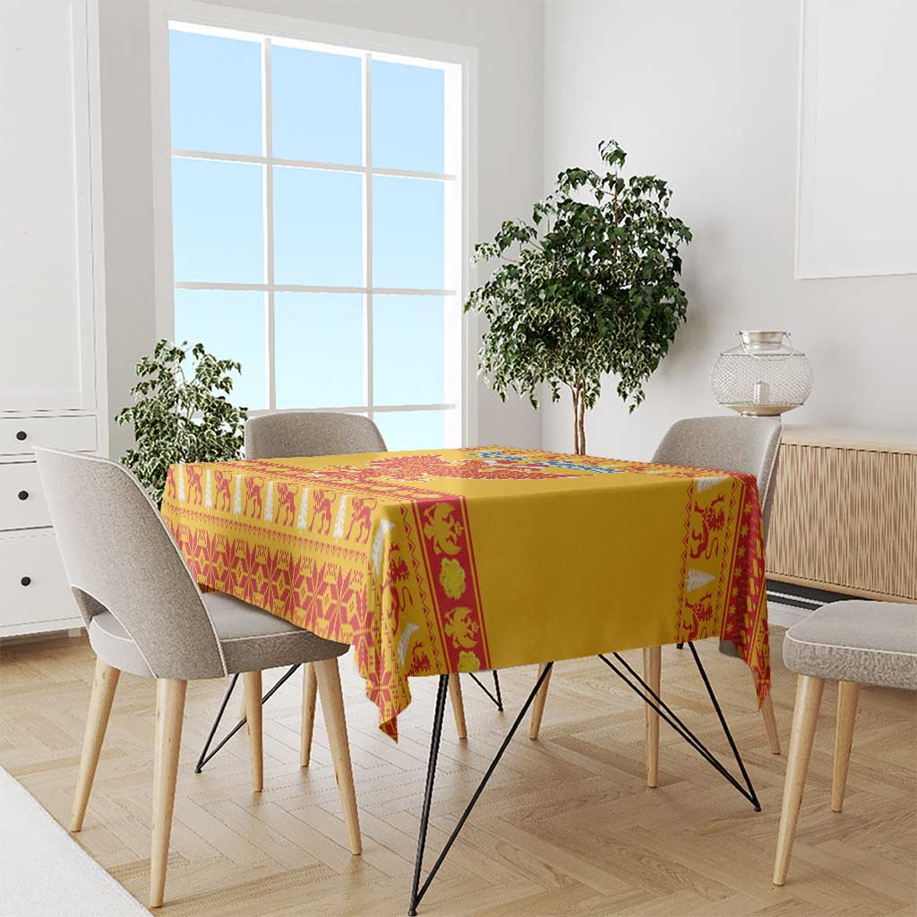 Yellow tablecloth with red geometric Christmas pattern and central eagle emblem