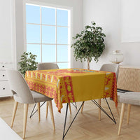 Yellow tablecloth with red geometric Christmas pattern and central eagle emblem