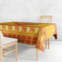 Yellow tablecloth with red and cream animal-and-tree festive pattern, triangular drape