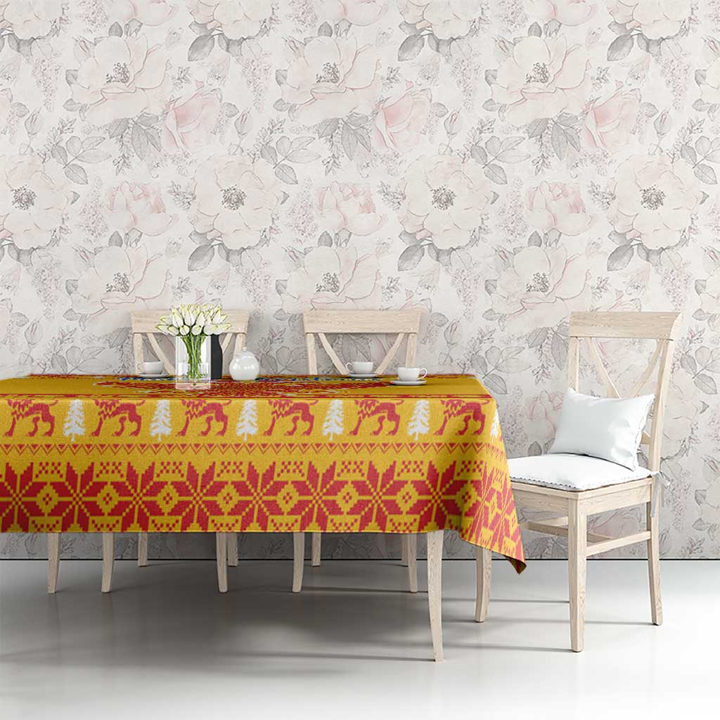 Yellow tablecloth with red and cream Christmas motif and decorative repeating border