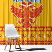 Close-up of yellow Christmas curtain panel with double-headed eagle and red patterned bottom