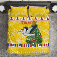 Yellow Christmas bedding set with stork, Christmas tree, and festive border design