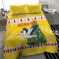Yellow Christmas bedding set with stork carrying ornaments and red tree graphic