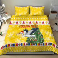 Yellow Christmas bedding set with stork, green tree, and striped decorative border