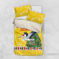 Yellow Christmas bedding set with stork and green Christmas tree, plus two pillow shams
