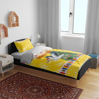 Yellow Christmas bedding set with stork scene and festive border on bed cover