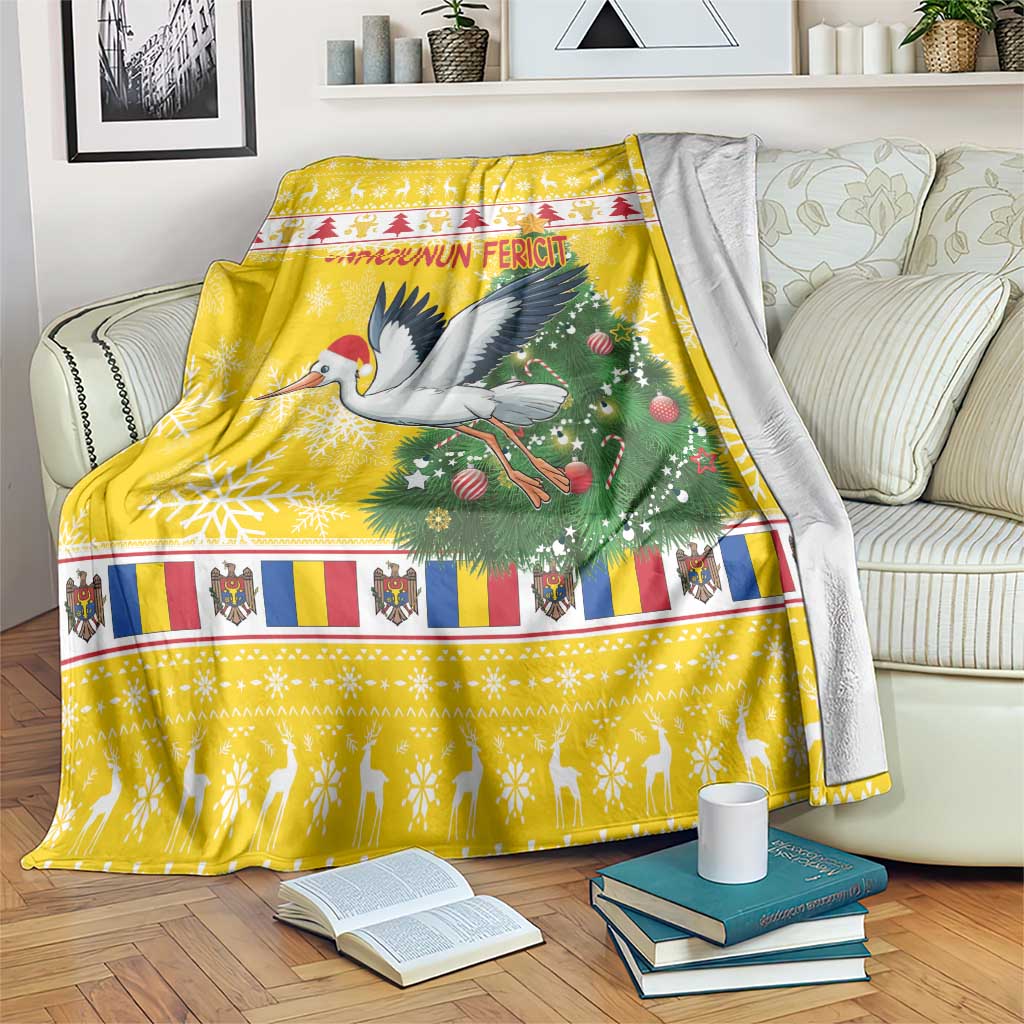 Yellow Christmas blanket draped over seating with stork, pine tree, “Craciunun Fericit”