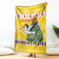 Yellow Christmas blanket with stork and pine tree, striped border, “Craciunun Fericit”