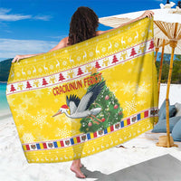 Yellow Christmas sarong wrap with stork, Santa, and Christmas tree graphic border