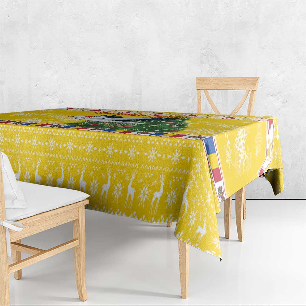 Yellow Christmas tablecloth draped over dining table with chair backs visible
