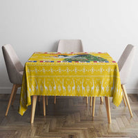 Yellow holiday tablecloth on dining table with four chairs