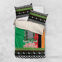 Green duvet set with matching pillowcases, zigzag border, animal silhouettes, and “Zambia Christmas” print