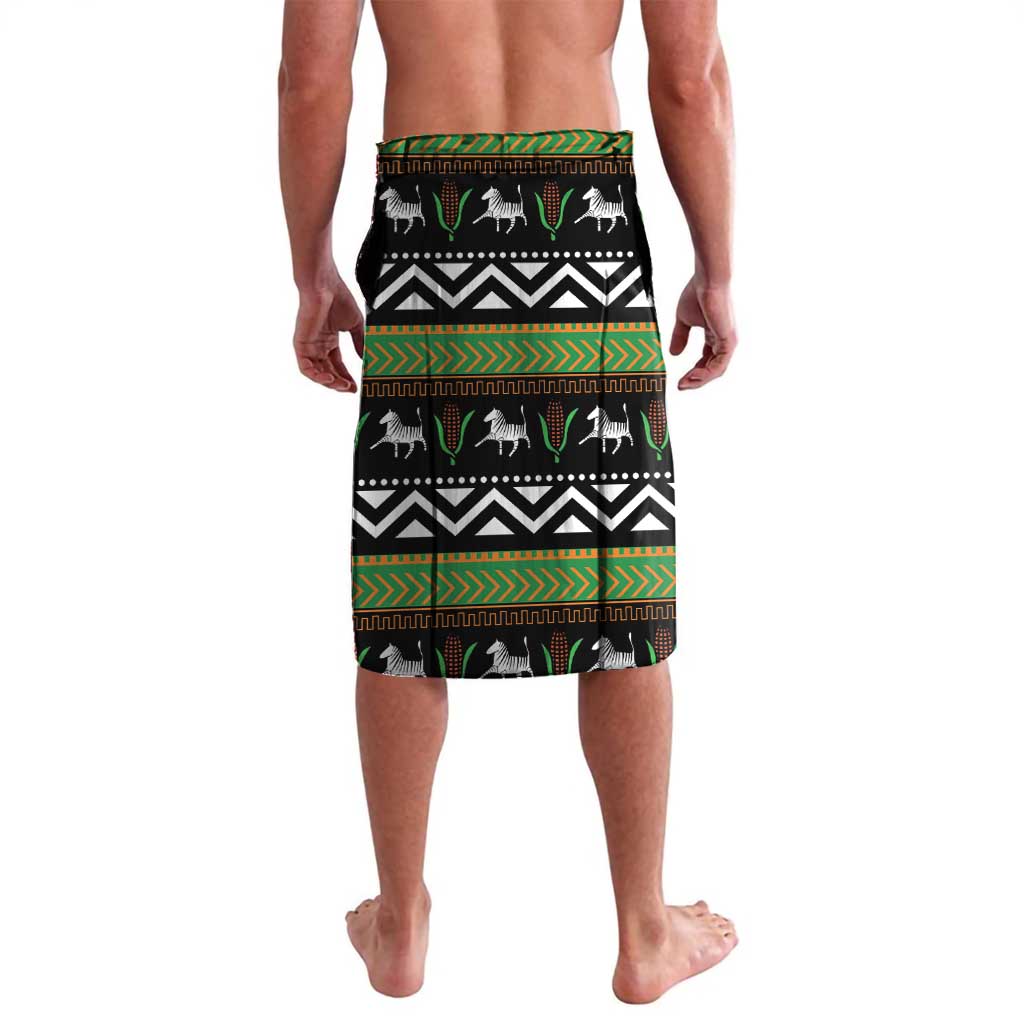 Green lavalava skirt with black-and-white geometric kente pattern and animal silhouettes