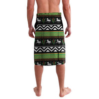 Green lavalava skirt with black-and-white geometric kente pattern and animal silhouettes