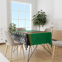 Green Zambia Christmas tablecloth with multicolor stripe border and zigzag, animal motif
