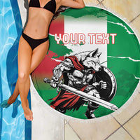 Green round beach blanket with fringe, wolf warrior graphic and “YOUR TEXT” view by pool