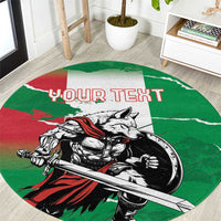 Green round area rug with wolf warrior grunge graphic and 'YOUR TEXT' custom lettering.
