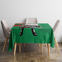 Green tablecloth with wolf warrior grunge design centered on a square dining table.