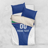 Blue football bedding set, top view: two blue pillowcases over white duvet with “GO YOUR TEXT”.