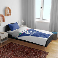 Blue football bedding set on bed with “GO YOUR TEXT” print across the duvet center.