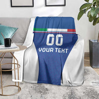 Blue and white football blanket with Italy flag stripes and 'YOUR TEXT' on sofa
