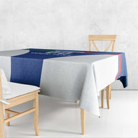 Blue tablecloth with stripe border, draped over dining table and chairs